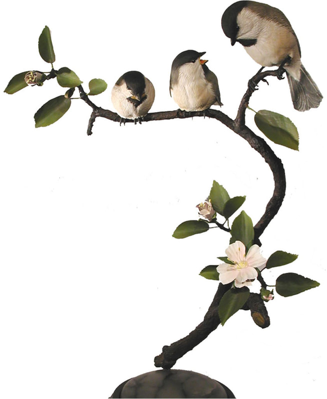 Carver: Olaf Karbinski
Title: Black Capped Chickadee Family on Apple Blossoms
Wood: Tupelo with Brass & Copper Foil & Wire
Dimension: Live Size
Finish: Acrylics